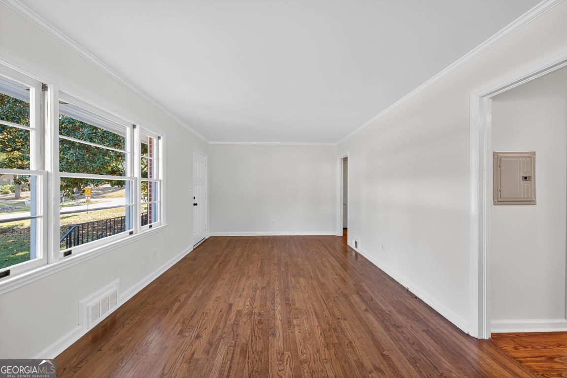 352 3rd Avenue Winder, GA 30680 - Photo 10 of 33 a view of wooden floor in an empty room with a window