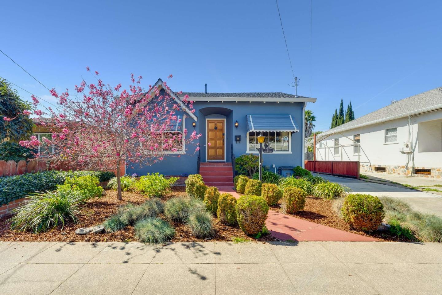 1256 Pierce Street Santa Clara, CA 95050 - Photo 1 of 46 a front view of a house with garden