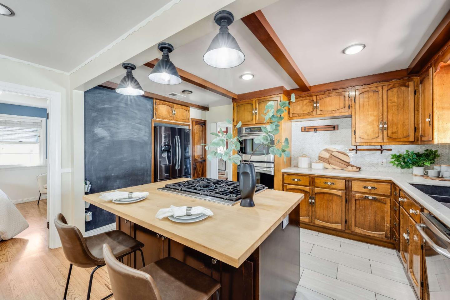 1256 Pierce Street Santa Clara, CA 95050 - Photo 11 of 46 a kitchen with stainless steel appliances kitchen island granite countertop a sink and cabinets