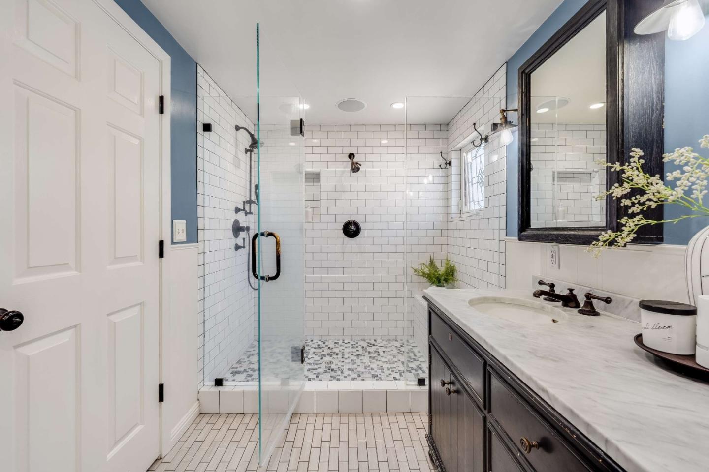 1256 Pierce Street Santa Clara, CA 95050 - Photo 14 of 46 a bathroom with a shower sink and mirror