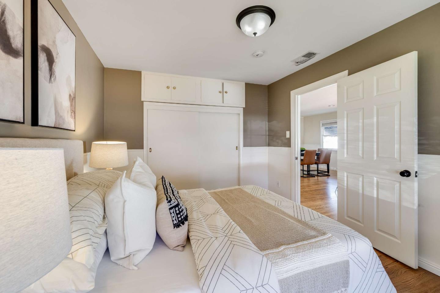 1256 Pierce Street Santa Clara, CA 95050 - Photo 16 of 46 a bedroom with a bed and a large mirror