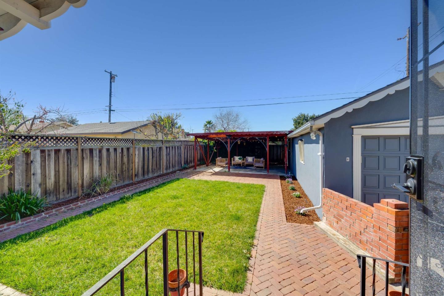 1256 Pierce Street Santa Clara, CA 95050 - Photo 33 of 46 a view of a house with wooden deck and furniture