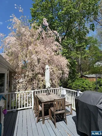 a view of balcony with wooden floor and outdoor seating