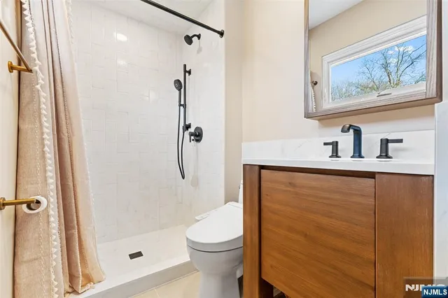 a bathroom with a shower and a toilet