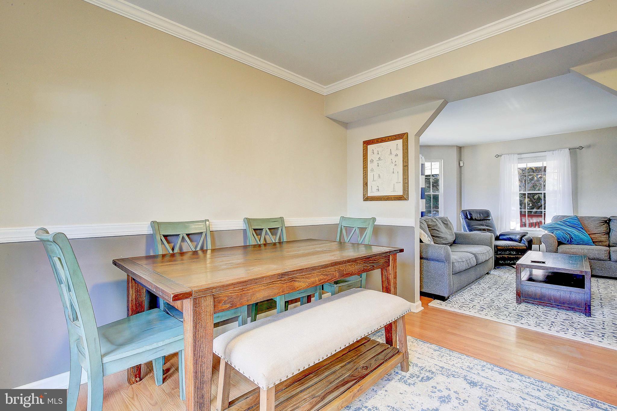 342 Metropolitan Boulevard Pasadena, MD 21122 - Photo 16 of 47 a living room with furniture and a table