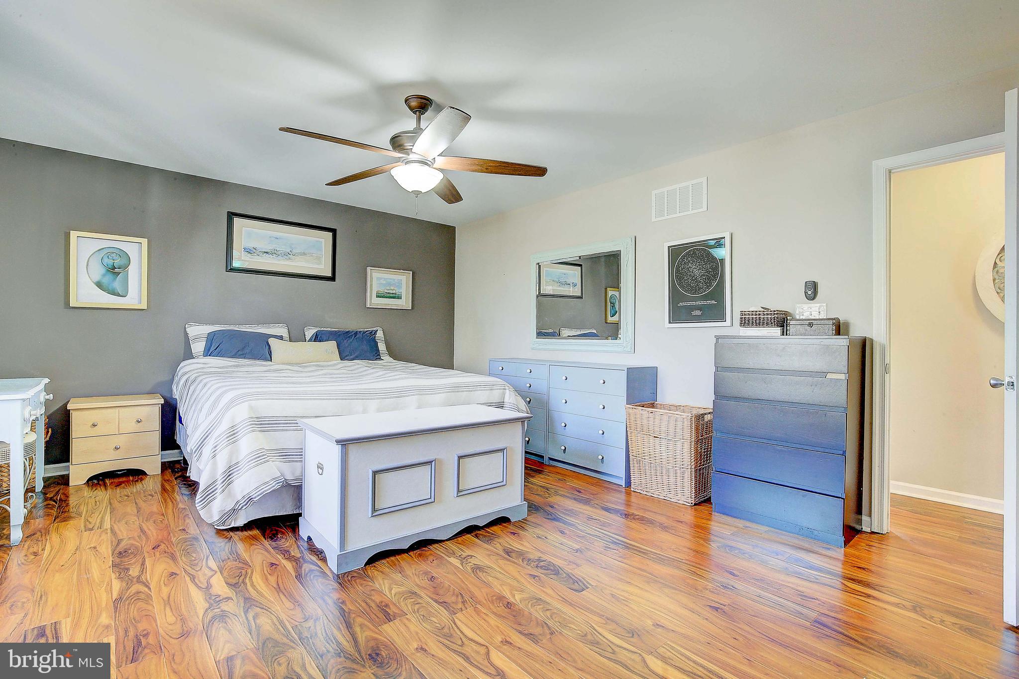 342 Metropolitan Boulevard Pasadena, MD 21122 - Photo 20 of 47 a bedroom with a bed and a dresser