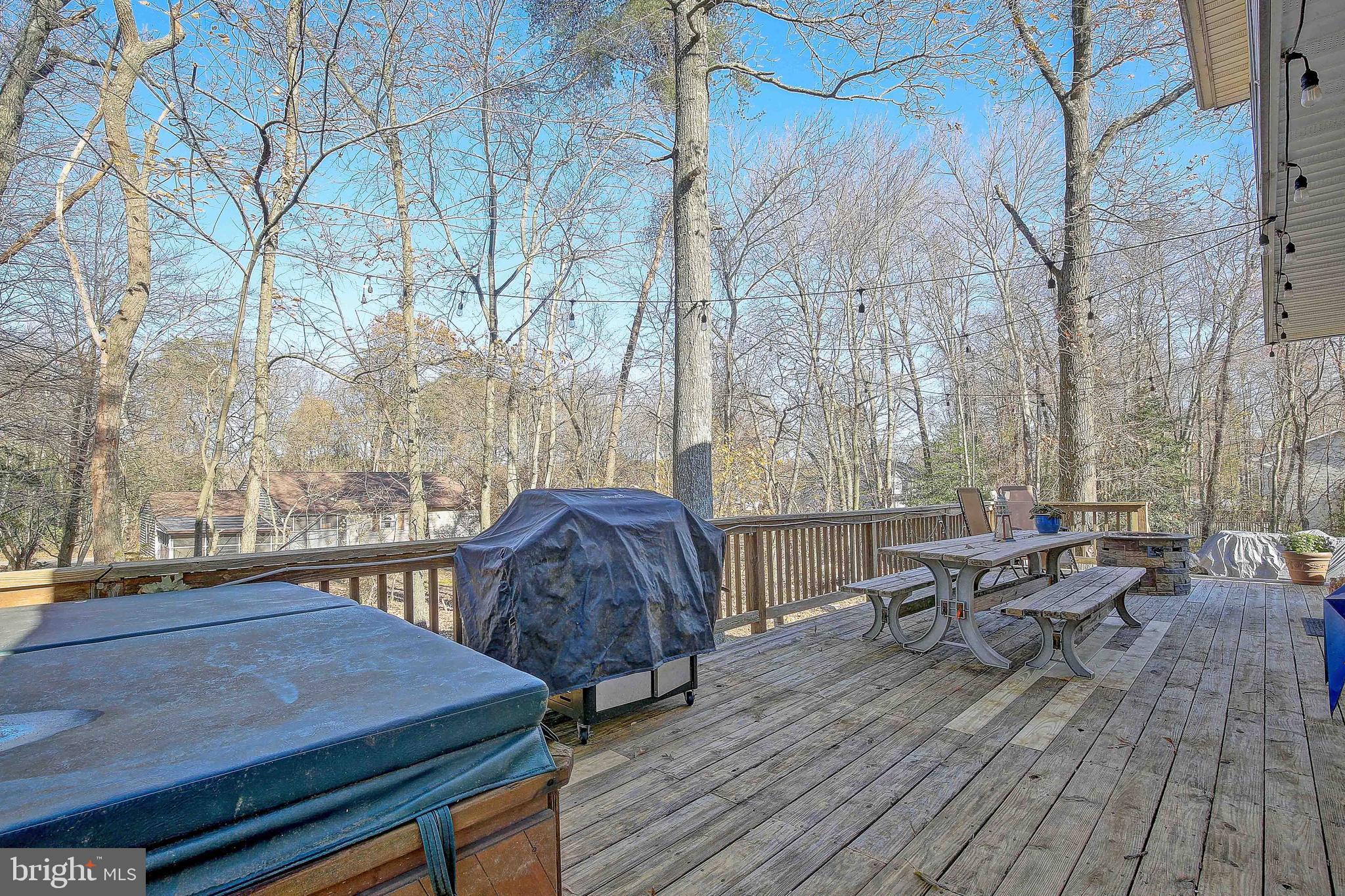 342 Metropolitan Boulevard Pasadena, MD 21122 - Photo 33 of 47 a view of a roof deck with table and chairs with wooden floor and fence
