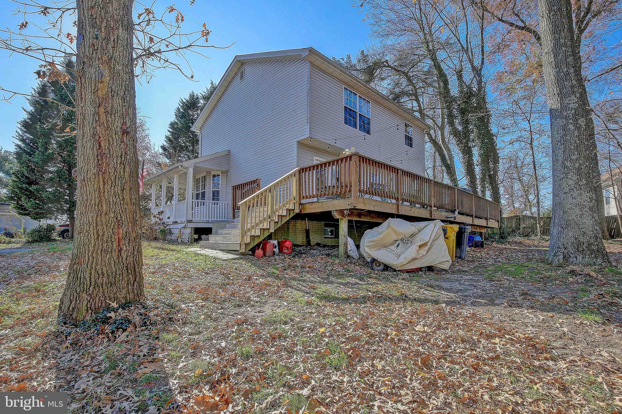 342 Metropolitan Boulevard Pasadena, MD 21122 - Photo 37 of 47 a view of a house with a yard and sitting area