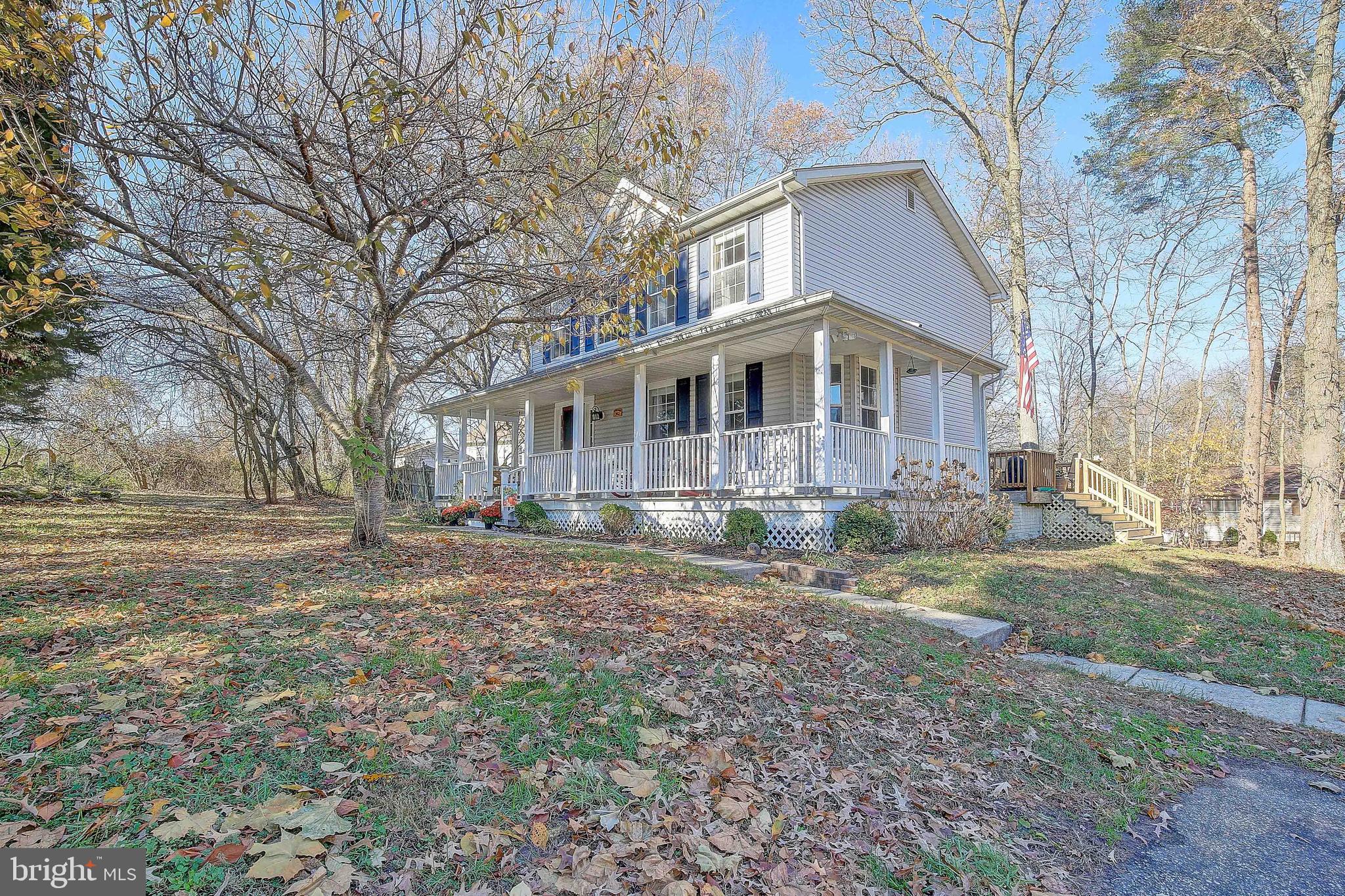 342 Metropolitan Boulevard Pasadena, MD 21122 - Photo 5 of 47 a front view of a house with a yard