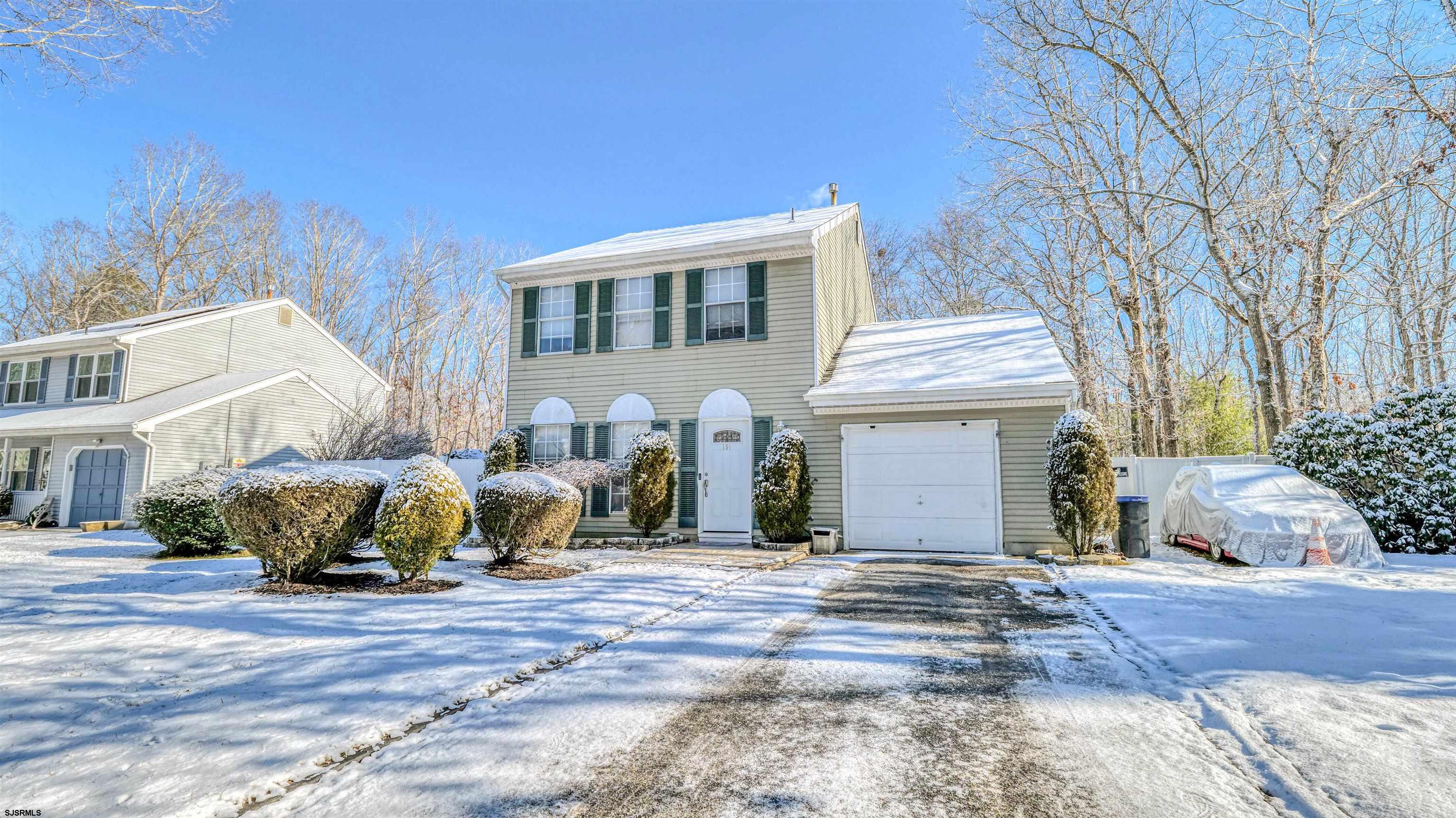 151 Concord Terrace Galloway Township, NJ 08205 - Photo 1 of 23 a front view of a house with large trees