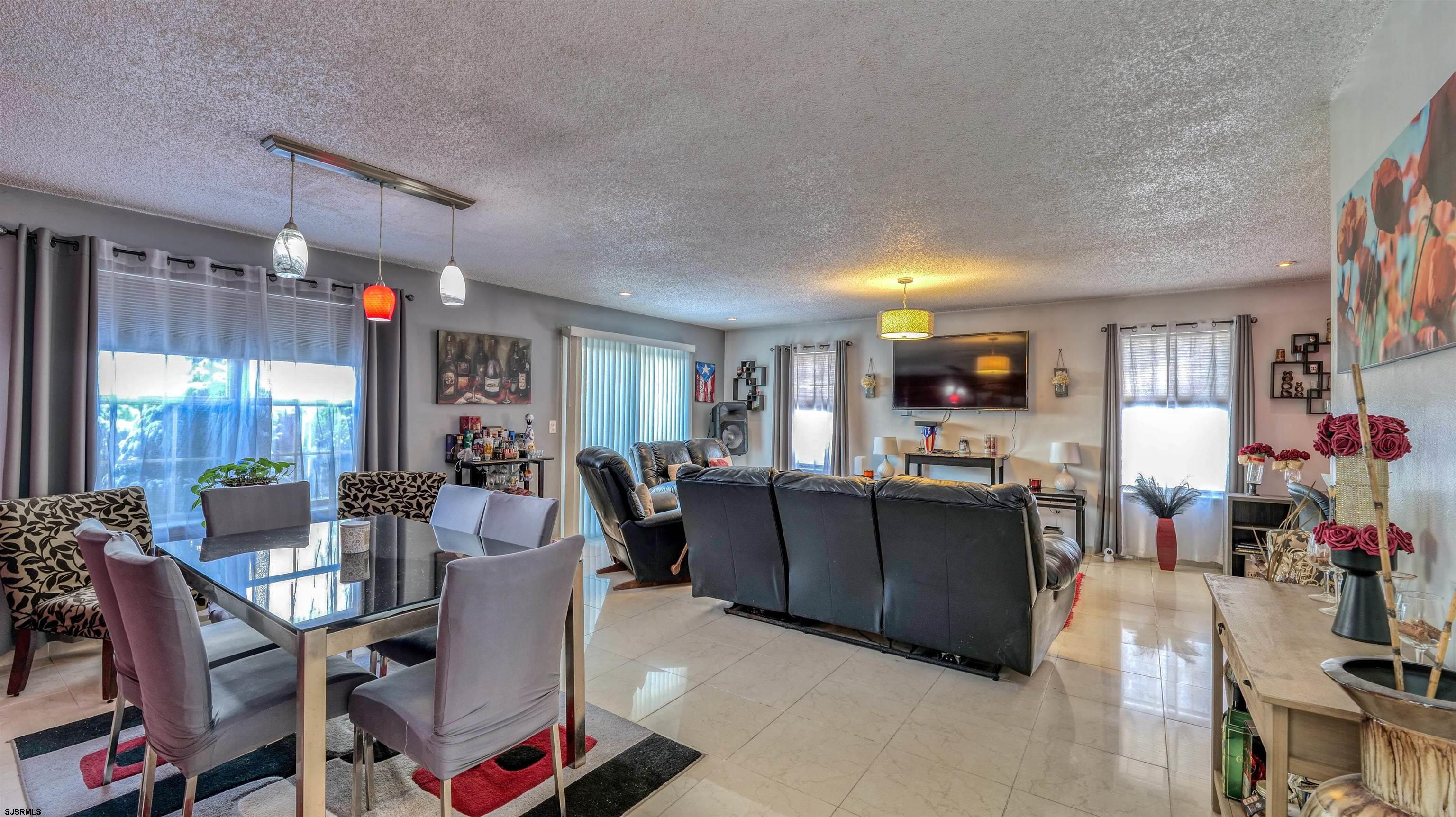 151 Concord Terrace Galloway Township, NJ 08205 - Photo 12 of 23 a living room with furniture and a flat screen tv