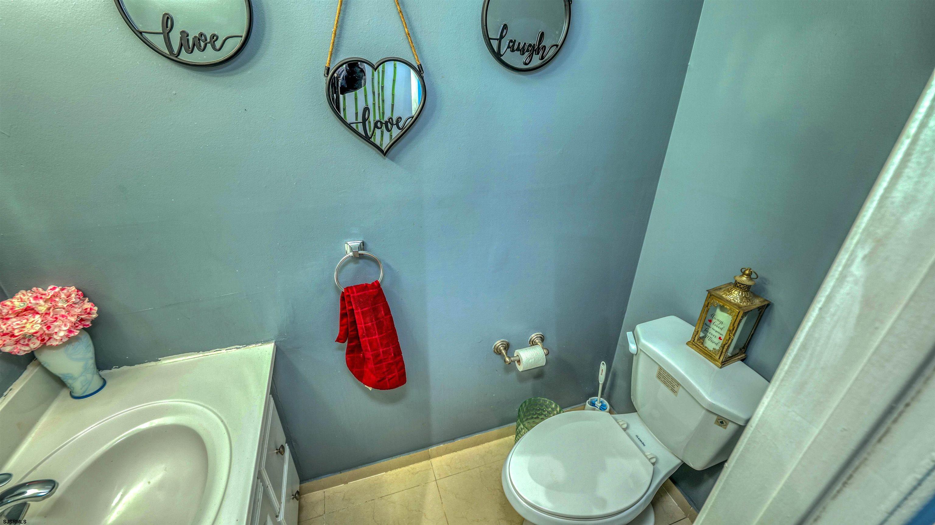 151 Concord Terrace Galloway Township, NJ 08205 - Photo 16 of 23 a bathroom with a toilet sink and mirror
