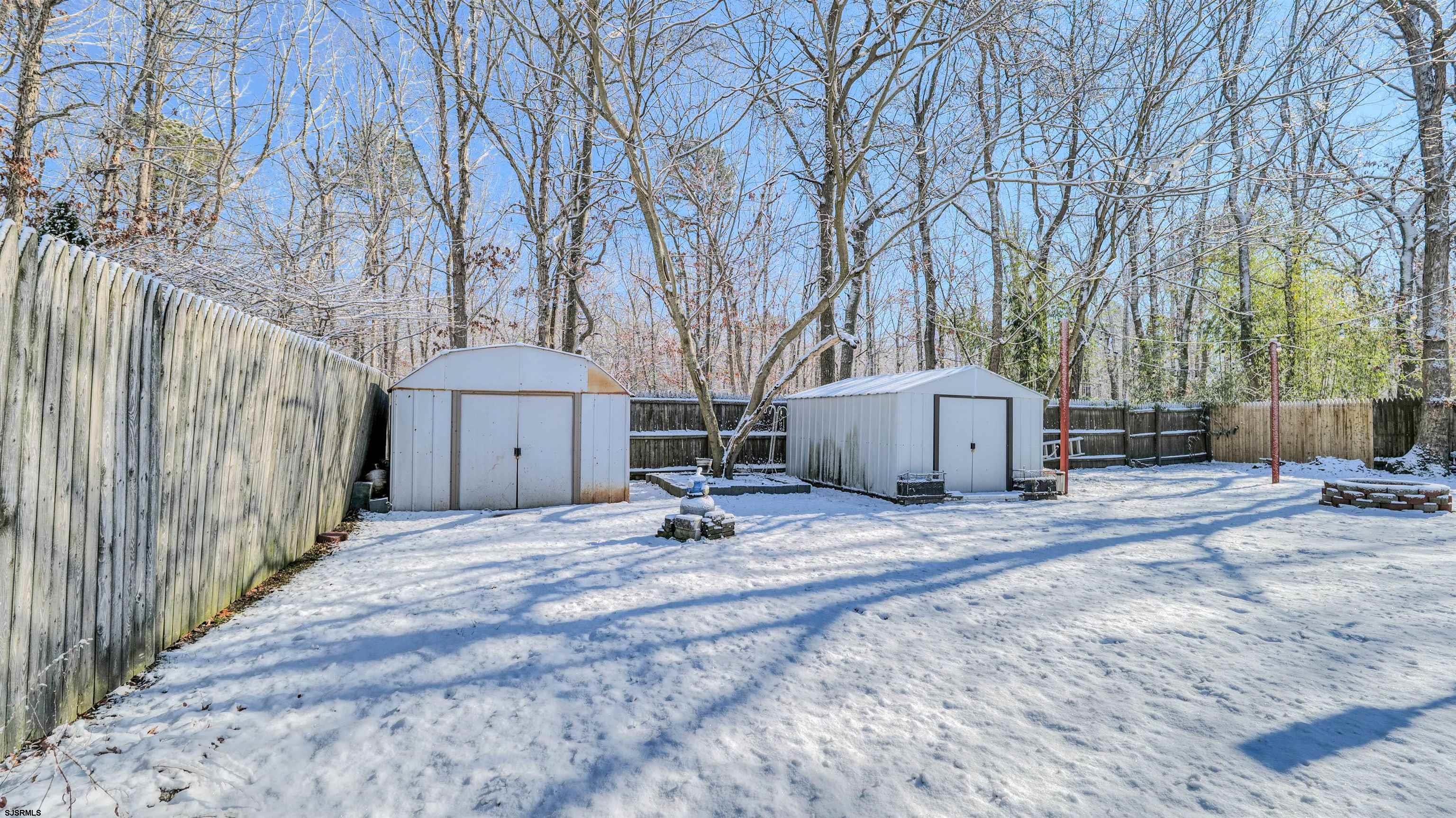 151 Concord Terrace Galloway Township, NJ 08205 - Photo 6 of 23 a backyard of a house with wooden floor patio and wooden fence