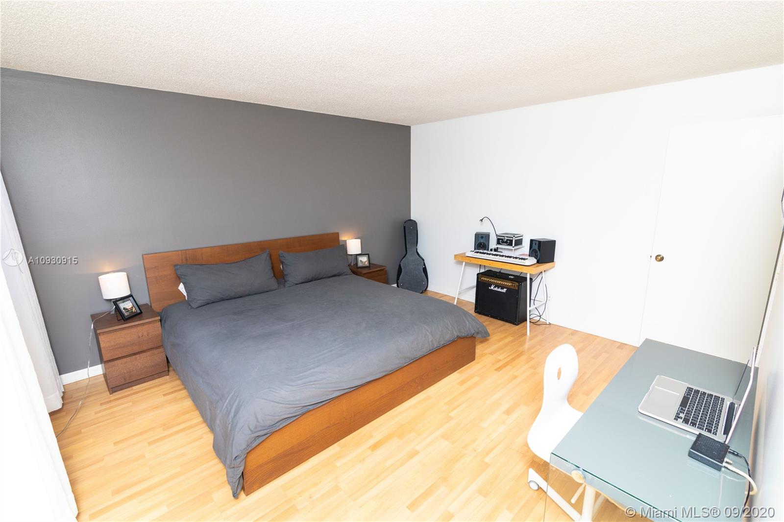 6607 Via Regina Boca Raton, FL 33433 - Photo 22 of 40 a bed sitting in a bedroom with a bed