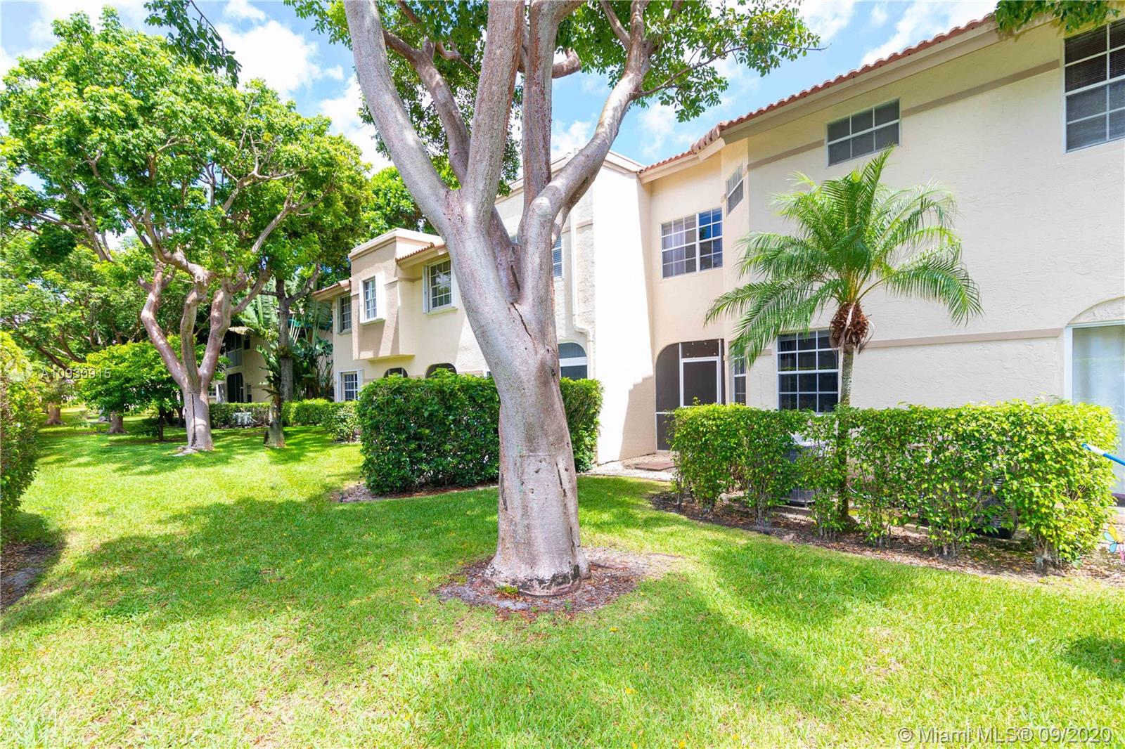 6607 Via Regina Boca Raton, FL 33433 - Photo 36 of 40 a front view of house with yard and green space