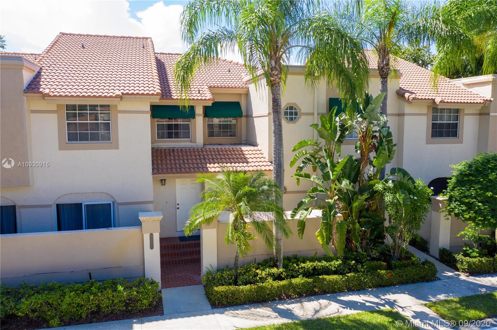 6607 Via Regina Boca Raton, FL 33433 - Photo 40 of 40 a front view of a house with a garden