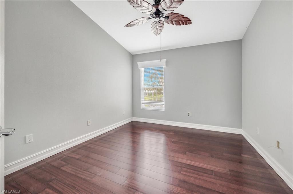 15845 Marcello Circle, Unit 83 Naples, FL 34110 - Photo 11 of 15 Second bedroom featuring ceiling fan and dark hardwood / wood-style floors