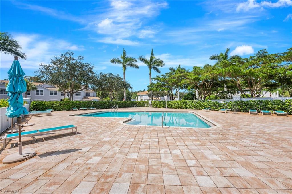 15845 Marcello Circle, Unit 83 Naples, FL 34110 - Photo 15 of 15 View of pool featuring a patio