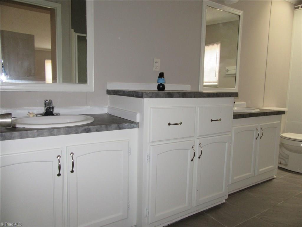 4830 Seward Road Pfafftown, NC 27040 - Photo 11 of 27 Remodeled Master bath with double sinks/vanities