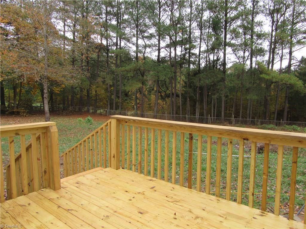 4830 Seward Road Pfafftown, NC 27040 - Photo 26 of 27 Back Deck and fenced yard