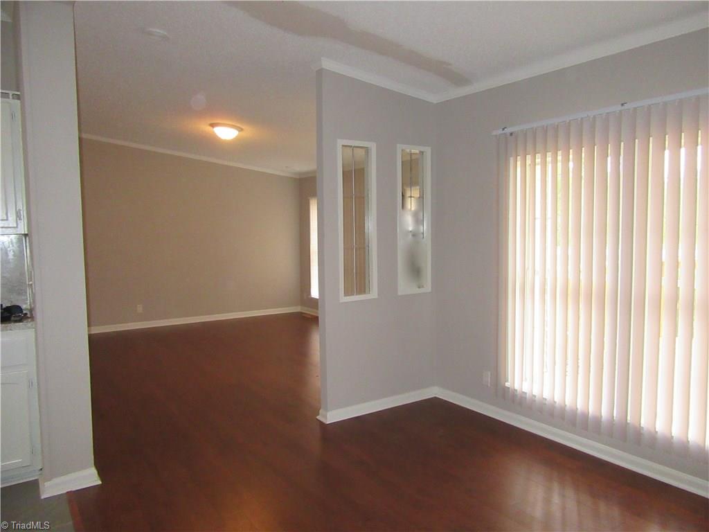 4830 Seward Road Pfafftown, NC 27040 - Photo 10 of 27 Looking from Dining room into Living room with all wood floors