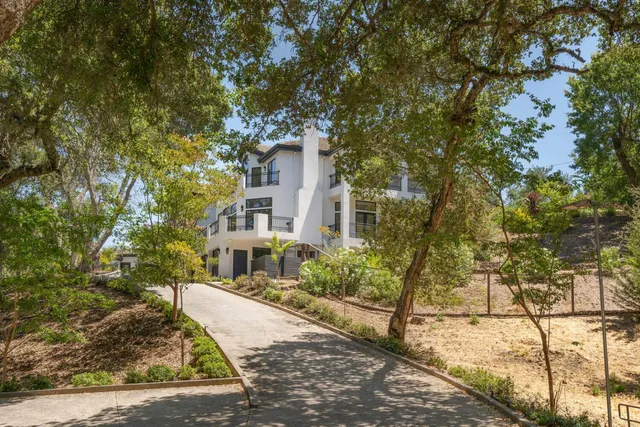 a view of a backyard of the house