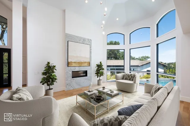 a living room with fireplace furniture and a flat screen tv