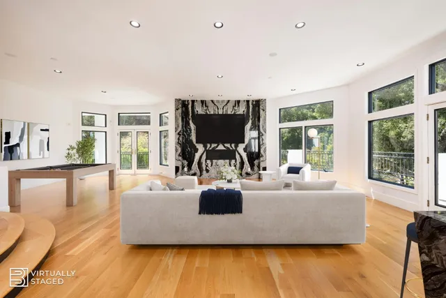 a kitchen with a sink a refrigerator and a stove top oven