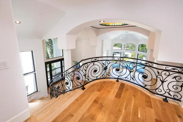 a view of a yard covered with snow in front of house