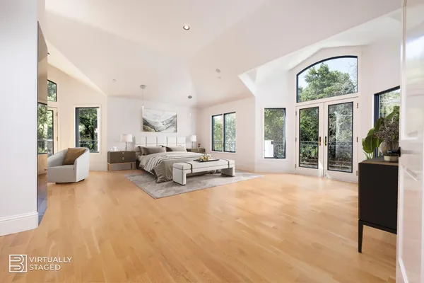 an aerial view of a house with swimming pool and sitting area