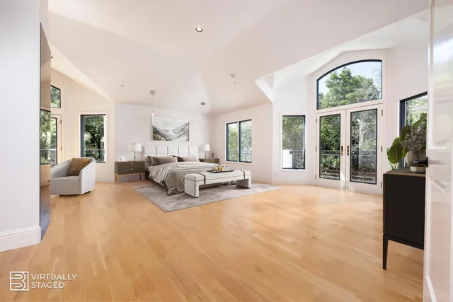 an aerial view of a house with swimming pool and sitting area