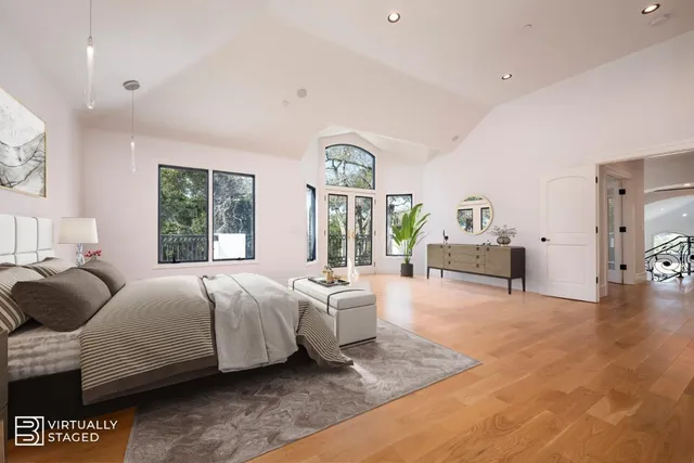 an aerial view of a house with a yard and trees