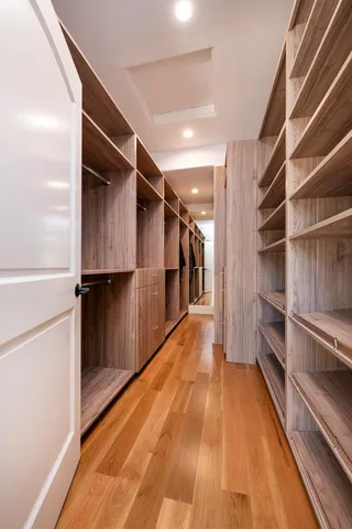 an aerial view of residential house with outdoor space and trees all around