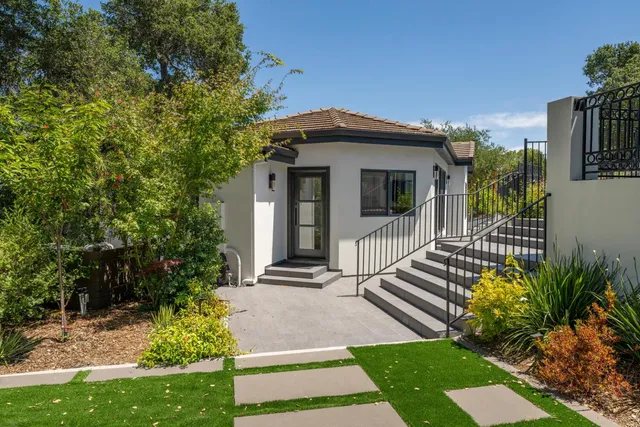 a front view of house with outdoor seating