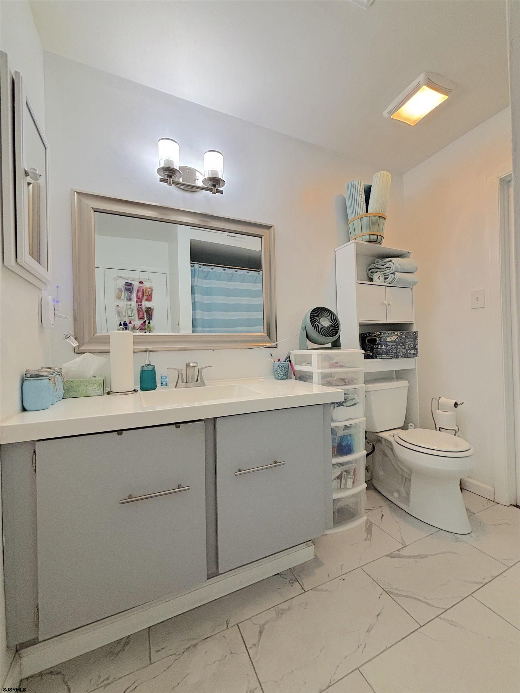 407 Mason Run, Unit 407 Clementon, NJ 08021 - Photo 16 of 22 a bathroom with a sink vanity and mirror