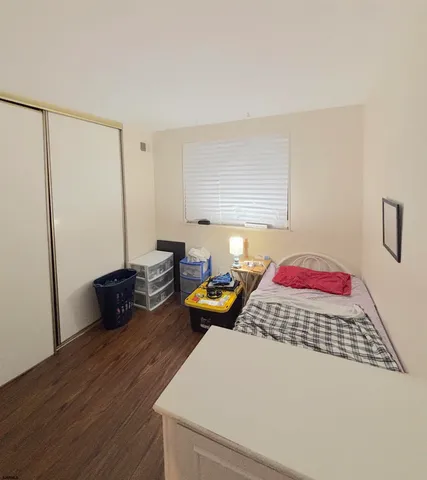 a bedroom with double bed and a window