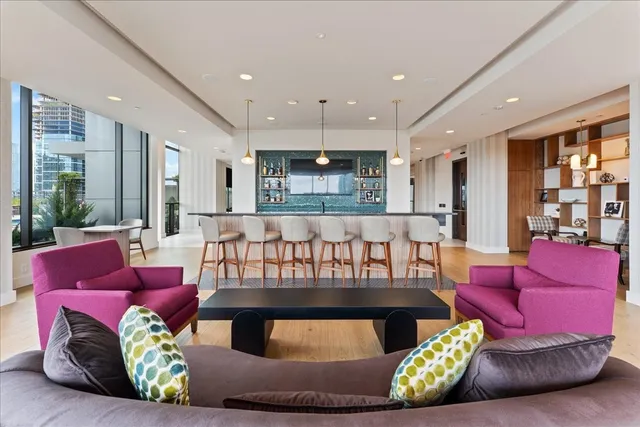 a living room with furniture and a large window