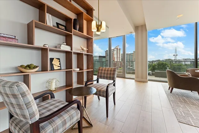 a view of couches and dinning table and chairs in patio