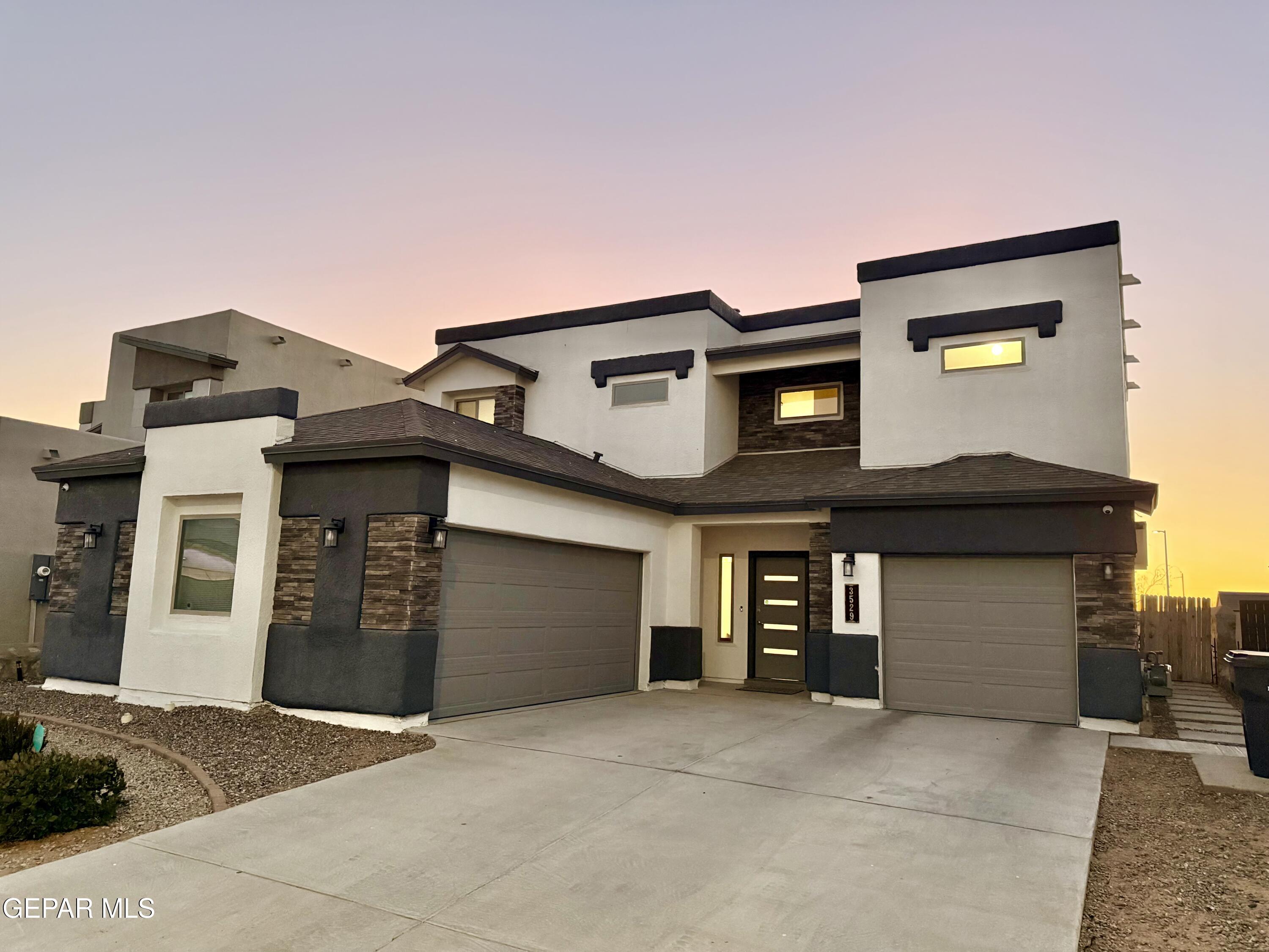 a front view of a house with a garage