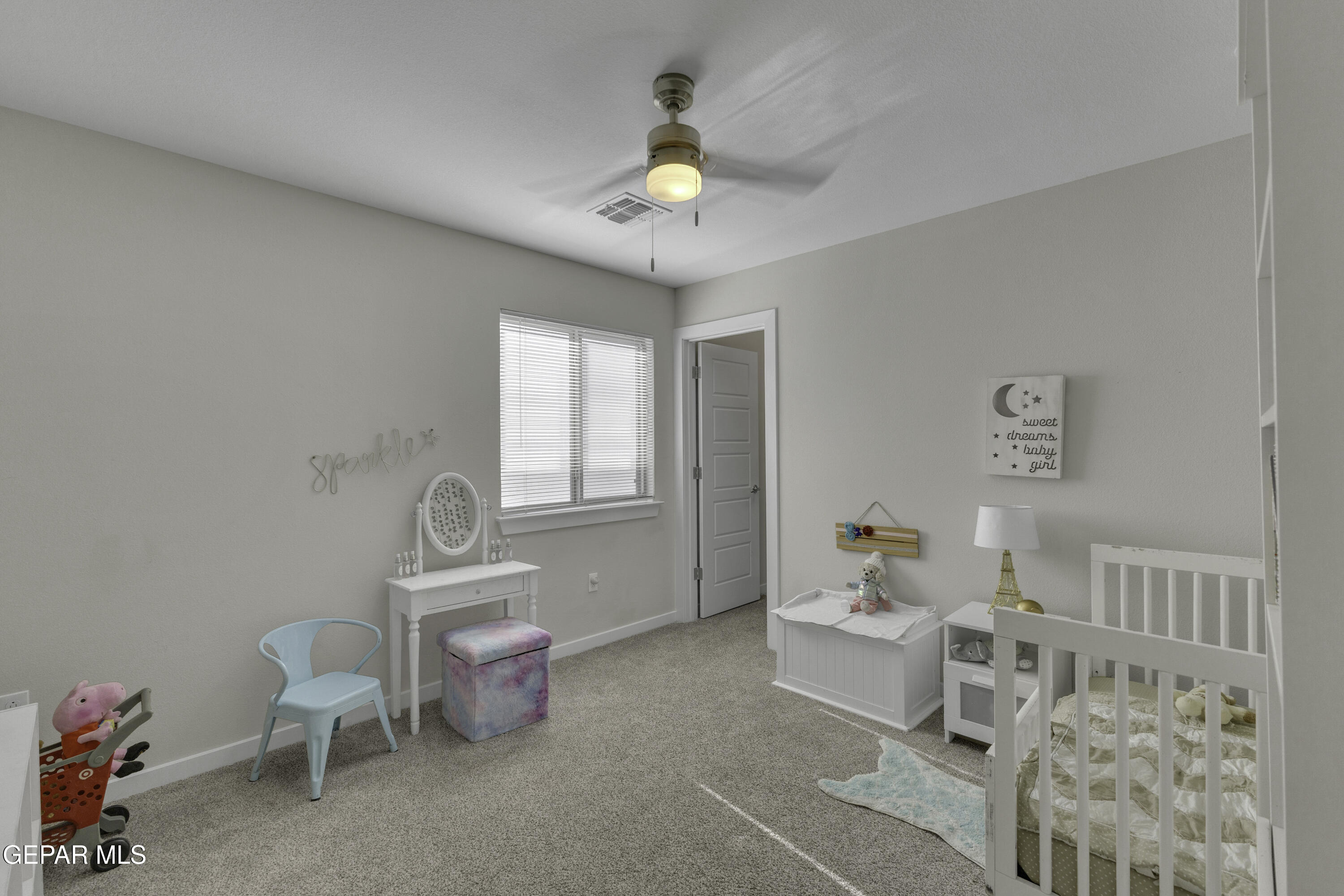 3529 Essence Street El Paso, TX 79938 - Photo 11 of 23 a living room with furniture and a chandelier