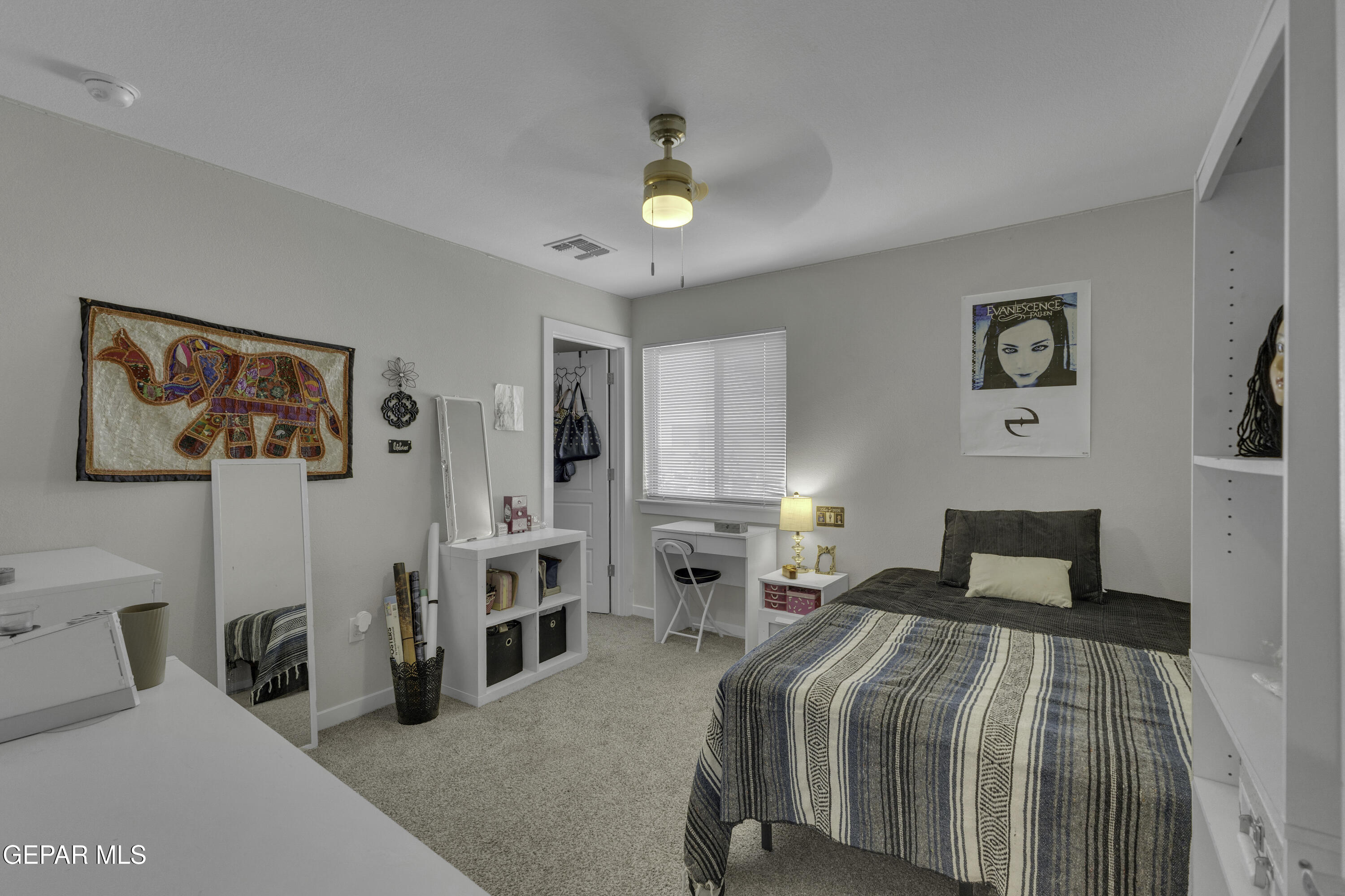 3529 Essence Street El Paso, TX 79938 - Photo 12 of 23 a bedroom with a bed and wooden floor