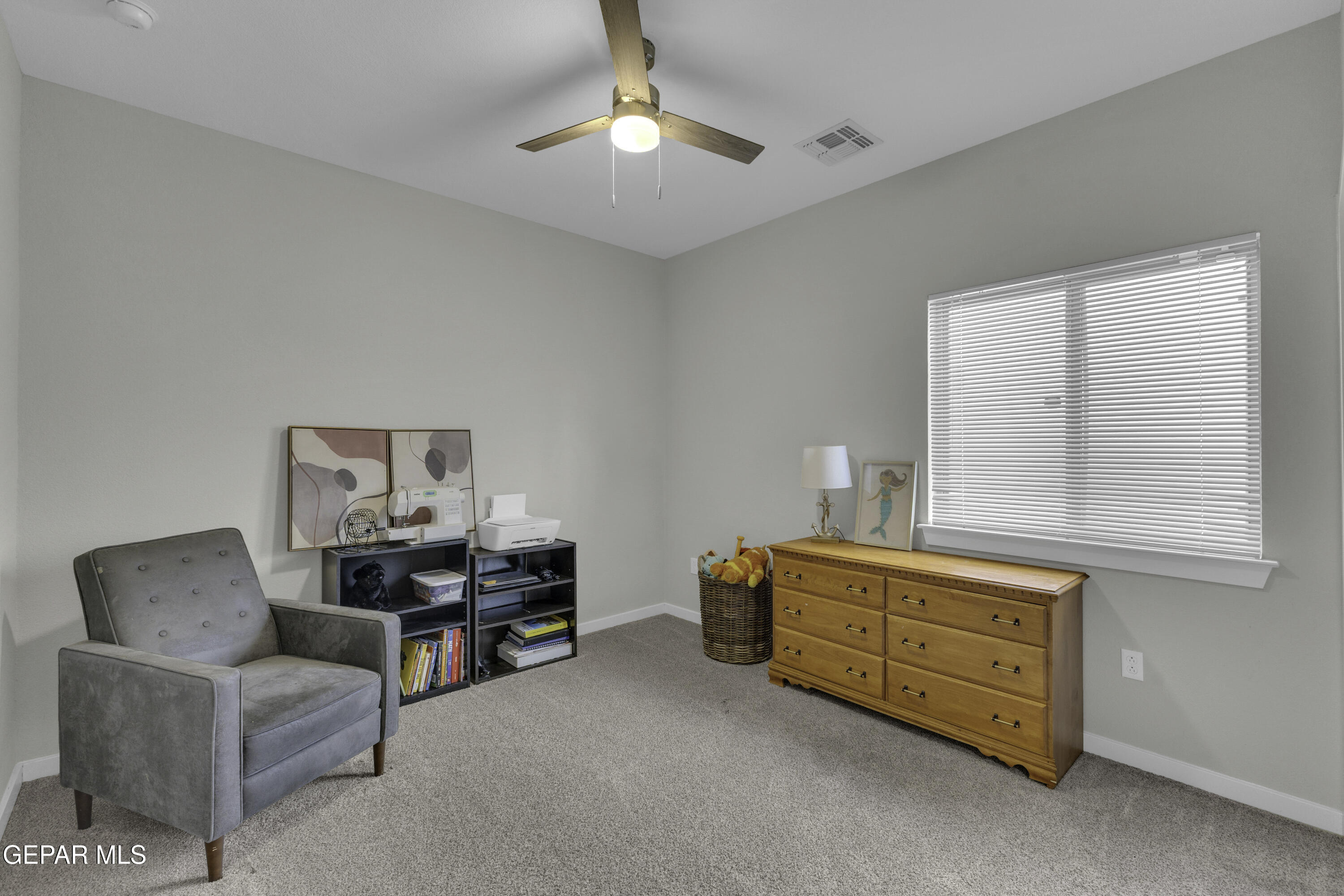 3529 Essence Street El Paso, TX 79938 - Photo 14 of 23 a living room with furniture and a lamp