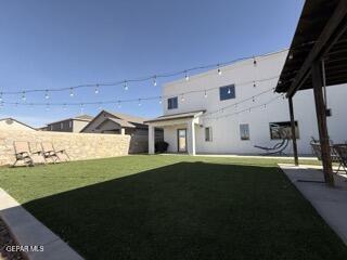 3529 Essence Street El Paso, TX 79938 - Photo 17 of 23 a front view of a house with a garden