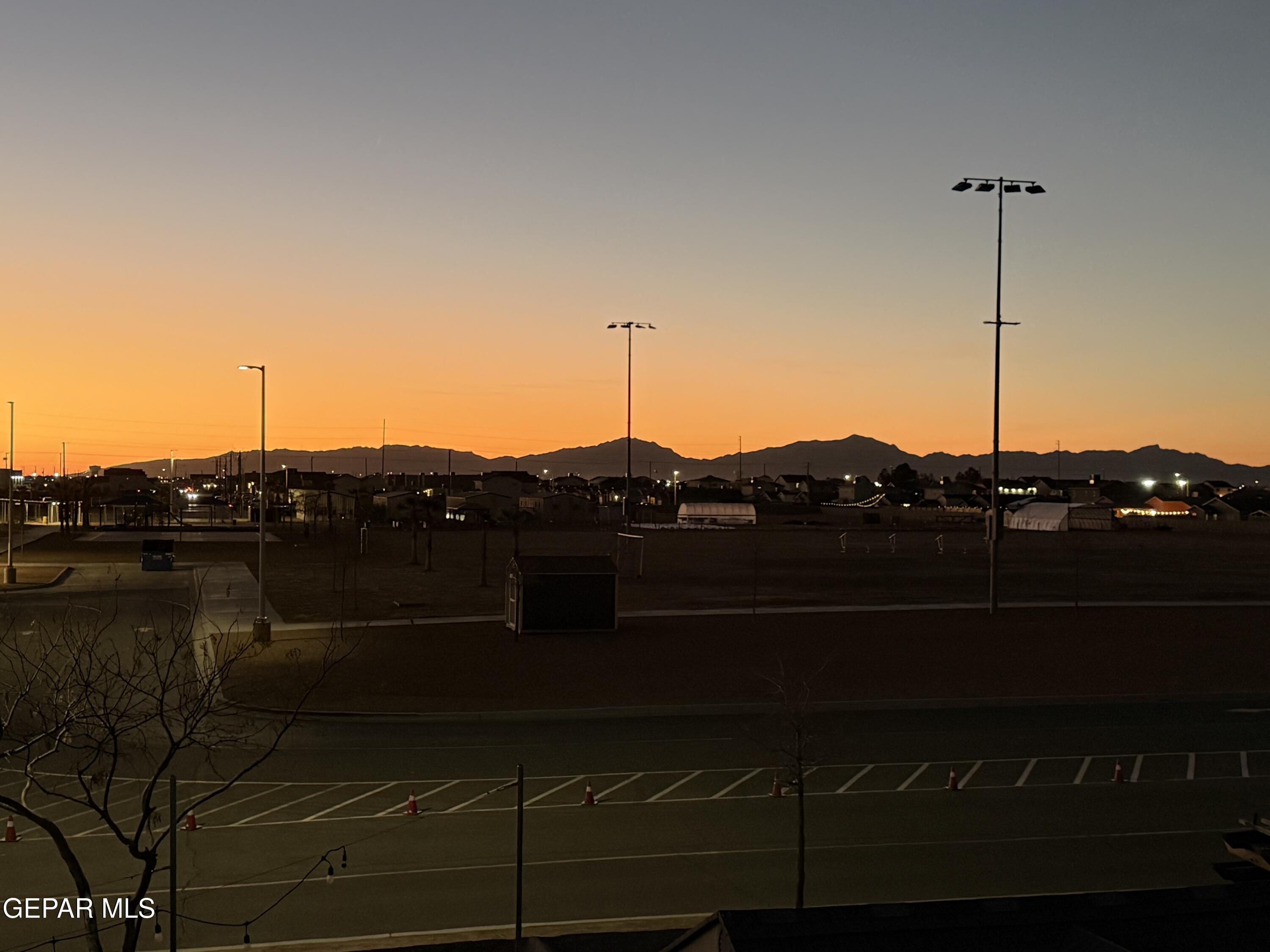 3529 Essence Street El Paso, TX 79938 - Photo 19 of 23 a view of a lake with a mountain in the background