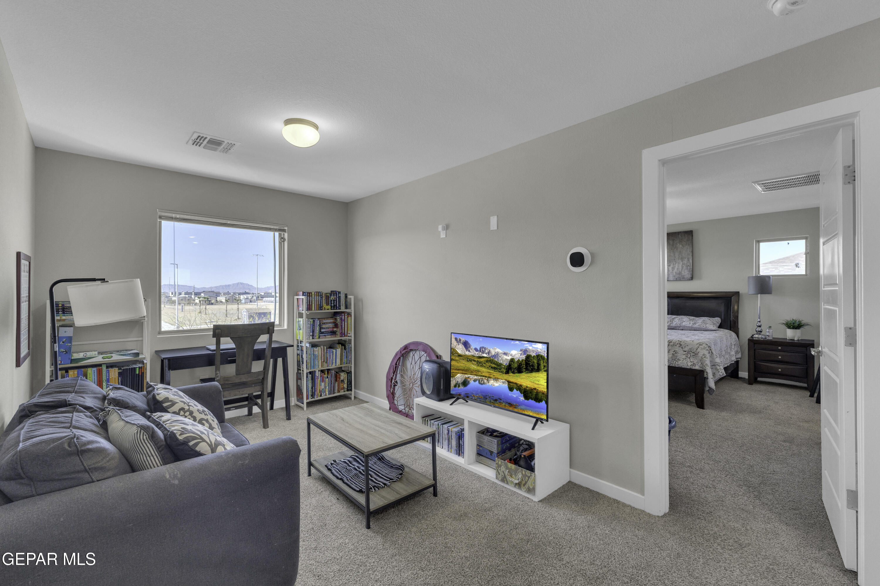 3529 Essence Street El Paso, TX 79938 - Photo 2 of 23 a living room with furniture and a flat screen tv