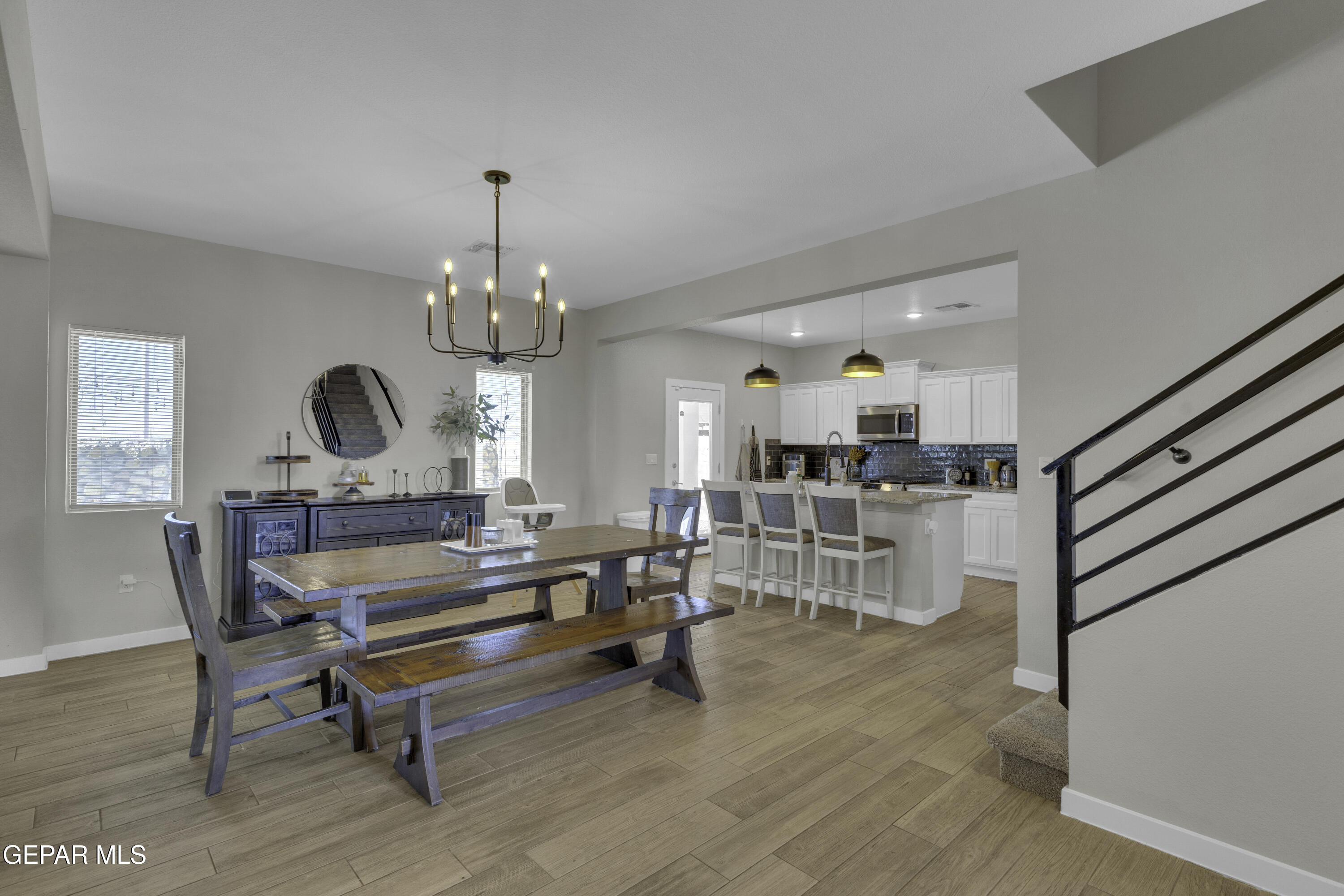 3529 Essence Street El Paso, TX 79938 - Photo 5 of 23 a living room with furniture and a chandelier