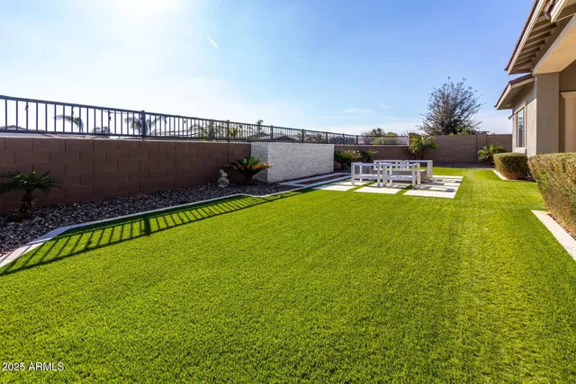 a view of swimming pool with a yard