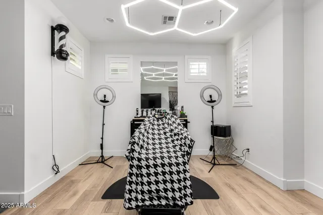 a open kitchen with stainless steel appliances kitchen island granite countertop a sink a stove and a wooden floors