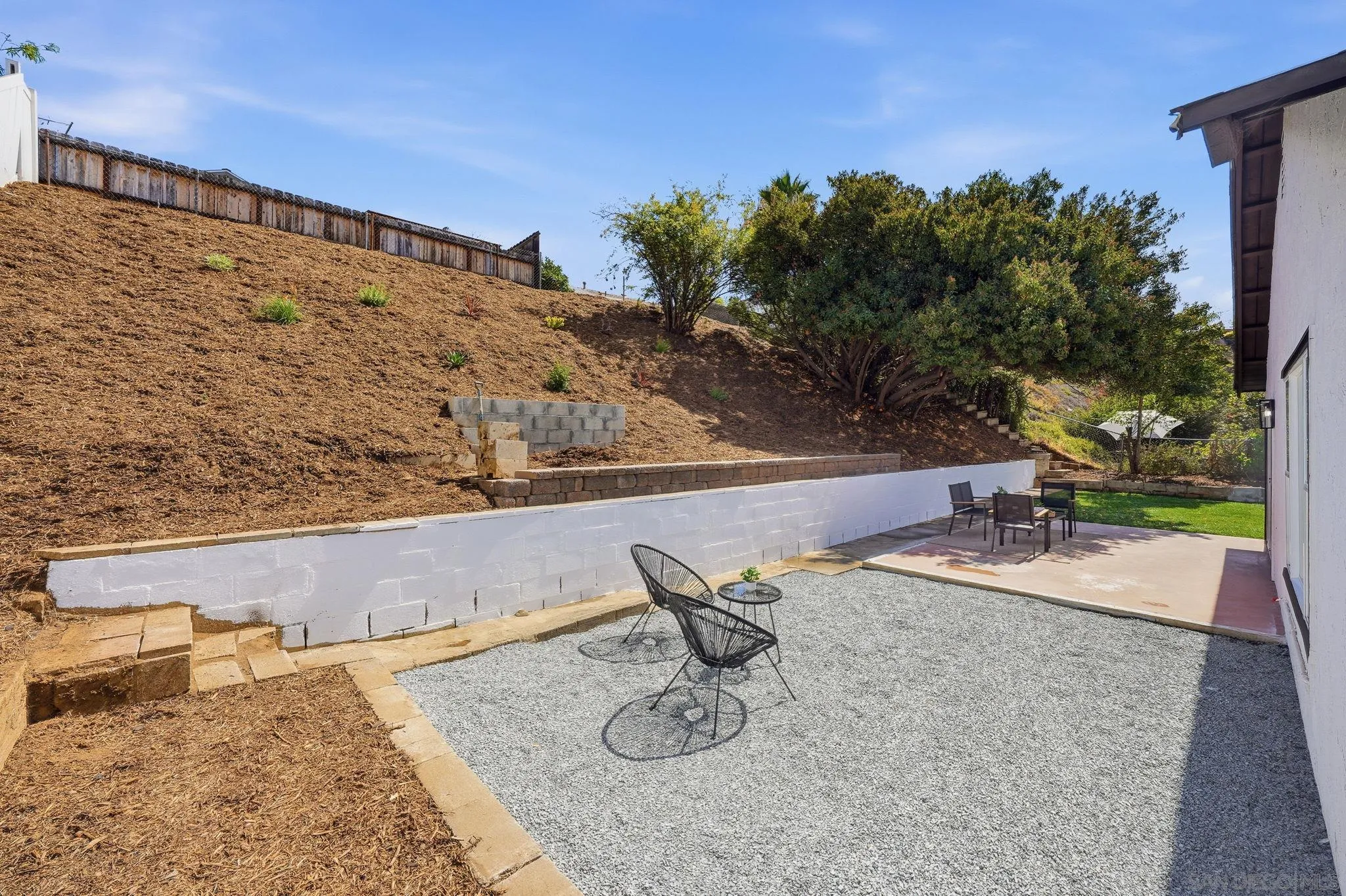 10440 Bosque Drive Lakeside, CA 92040 - Photo 46 of 47 a backyard of a house with table and chairs