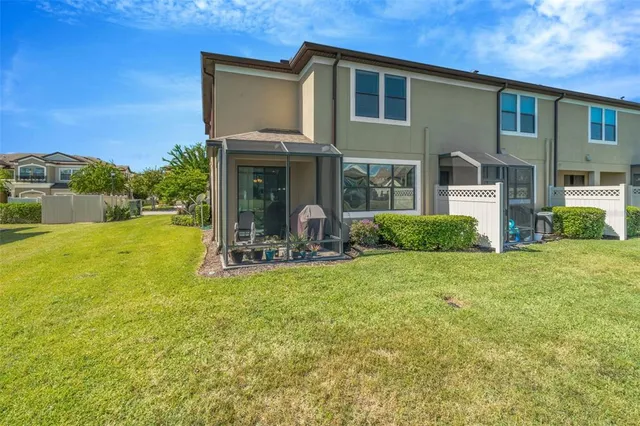 a view of a house with backyard porch and garden